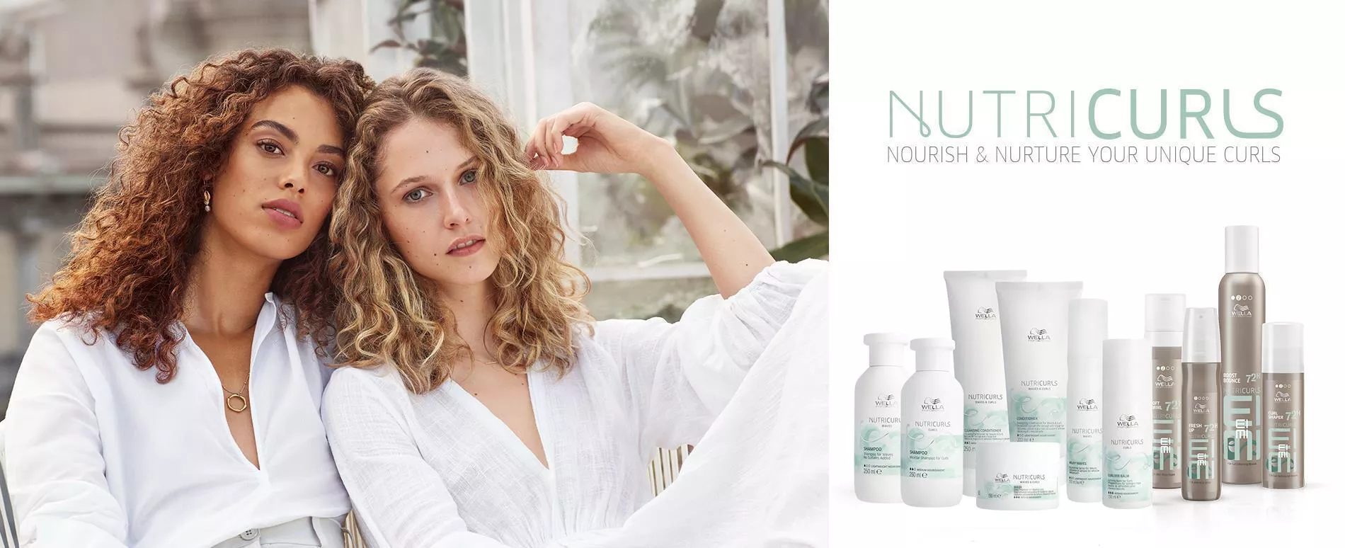 Two women with shoulder-length corkscrew curls in white clothes, sitting together, plus NUTRICURLS product bottles