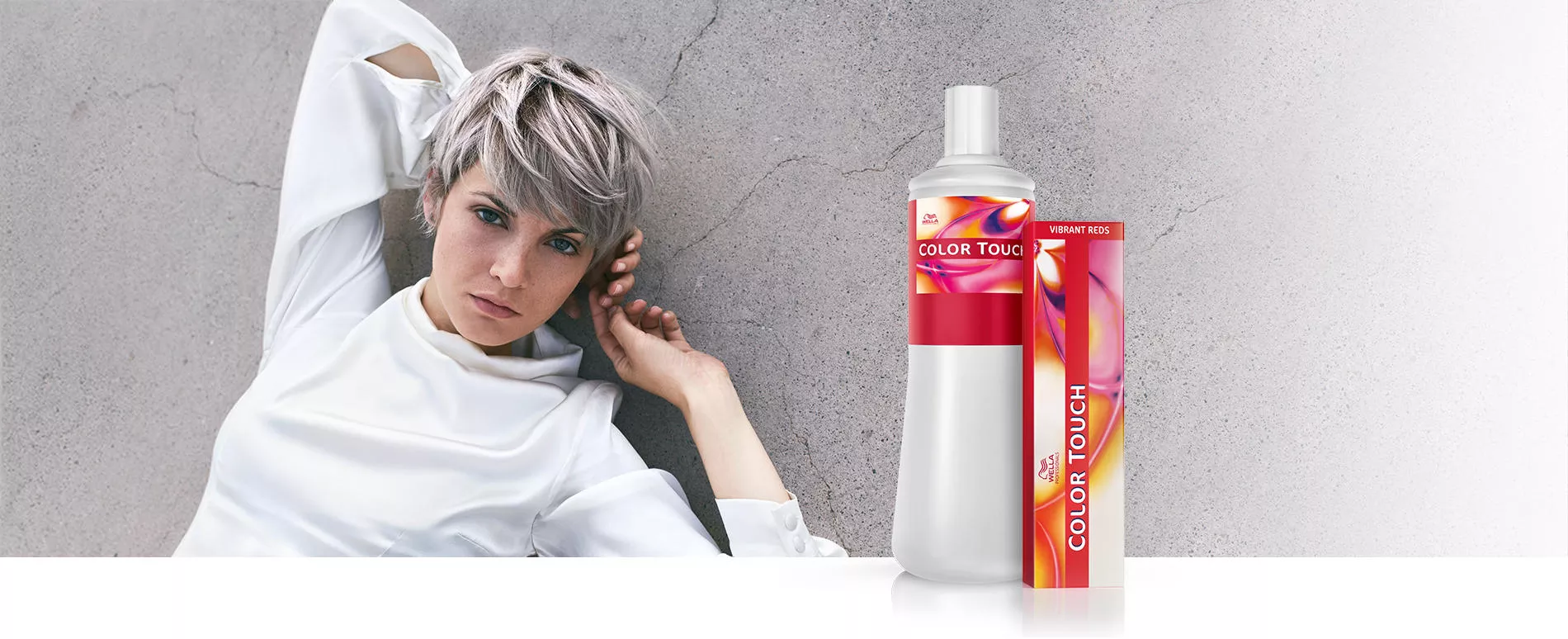 woman with short smoky blonde hair, and a box of color touch plus in the foreground