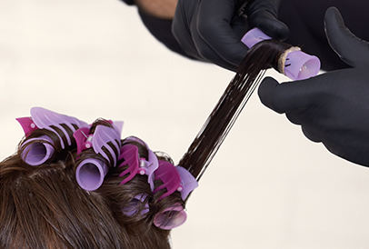 Winding hair onto rods for permanent curls