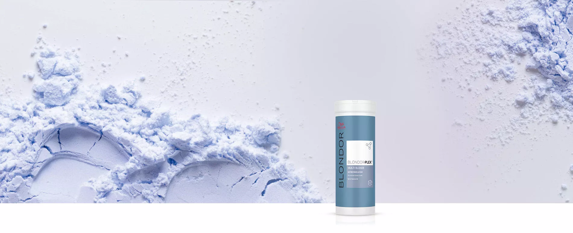 Packshot di BlondorPlex circondata da polvere blu su uno sfondo grigio