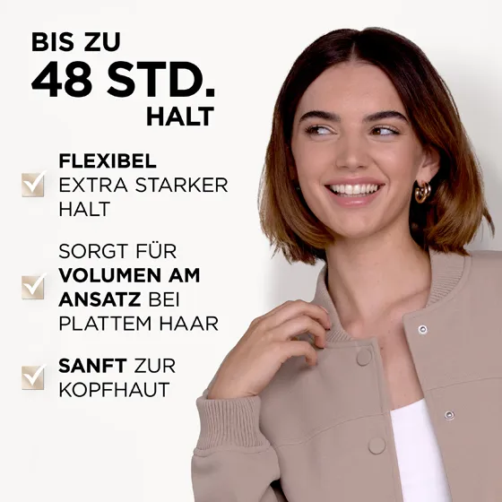 Model mit braunen, kinnlangen Haaren. Das Instant Volumen Haarspray von Wellaflex bietet bis zu 48 Stunden Halt. Zudem bietet es flexiblen extra starken Halt, sorgt für mehr Volumen am Haaransatz und ist sanft zur Kopfhaut.
